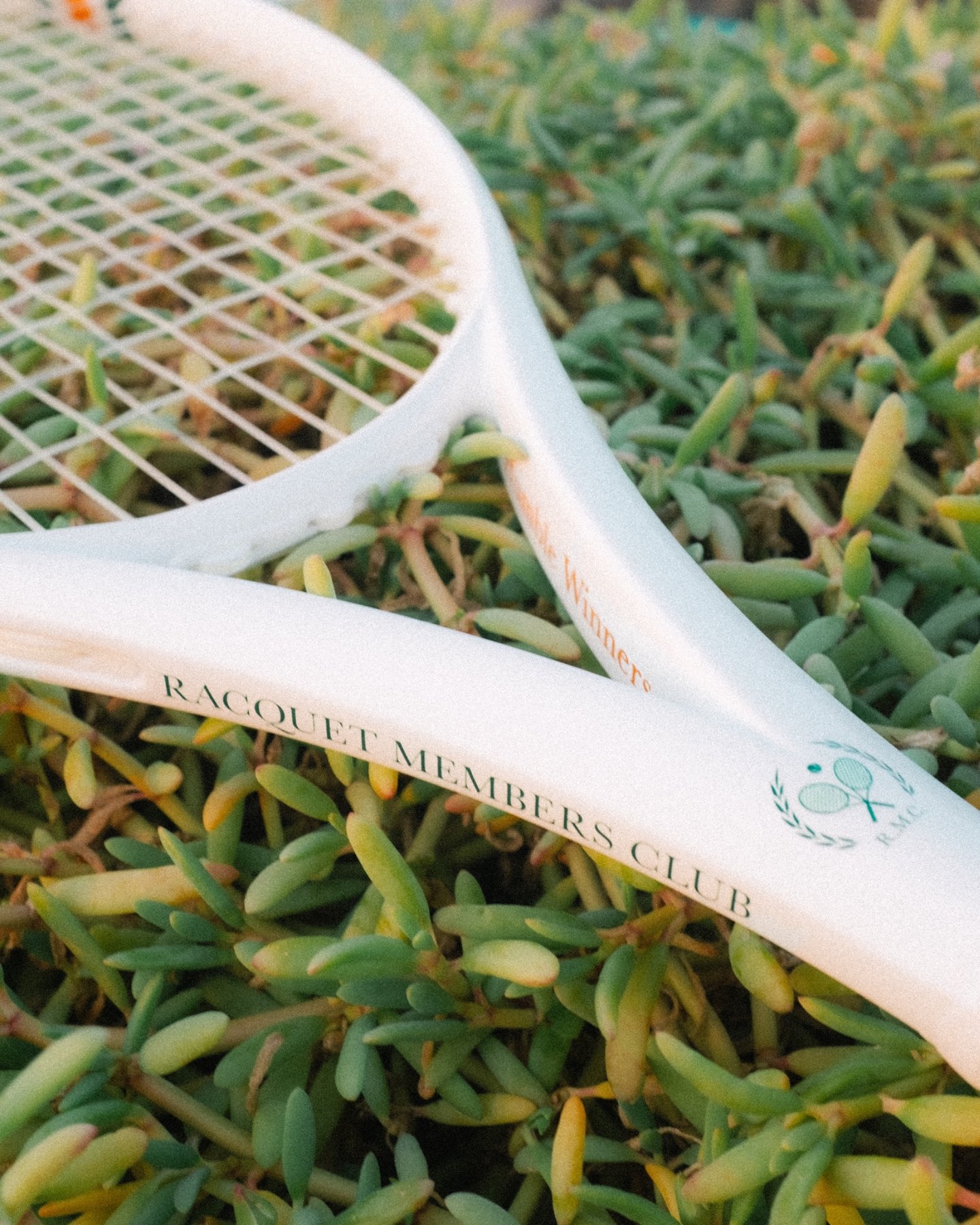A custom Racquet Members Club tennis racquet